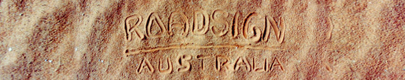 Roadsign written in sand